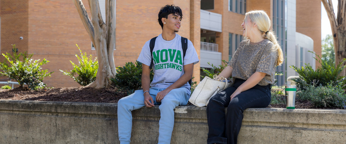 Image of students sitting on campus